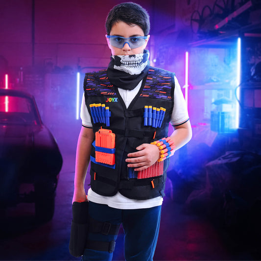 A child wearing a Nerf tactical vest with toy guns and darts